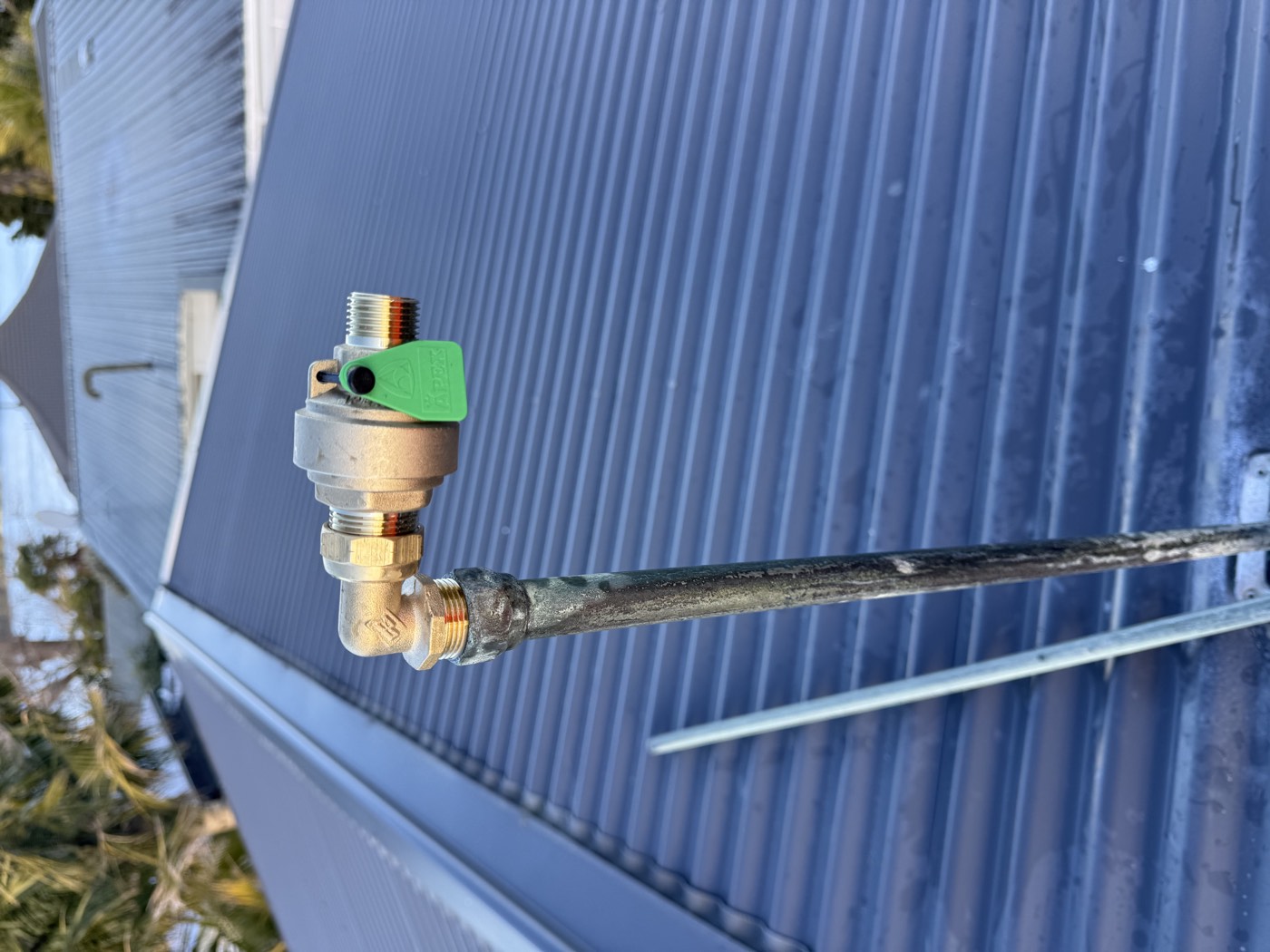 A replacement valve fitted to the galvanised supply pipe on a low pressure hot water cylinder