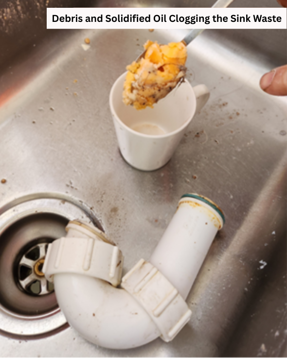 Grease and debris around sink waste